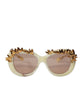 Chanel Sunglasses with gold decorative elements on a white background