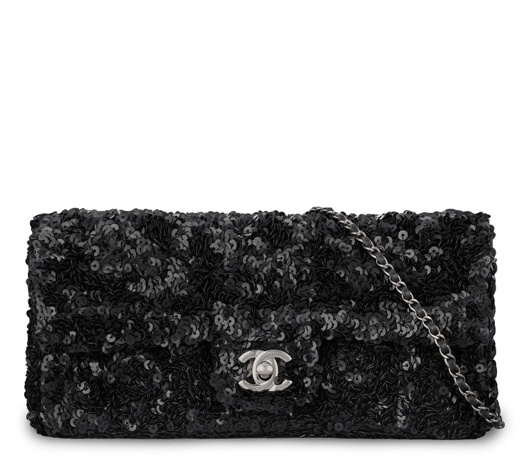 Chanel black sequin East West Flap Bag from 2014–15 with silver-tone CC hardware and leather-interwoven chain shoulder strap.