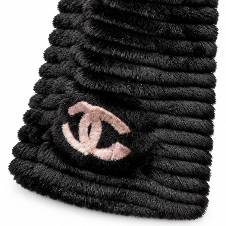 Black wool and Orylag scarf by Chanel, featuring luxurious fabric and elegant design, draped to showcase its texture and style.