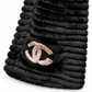 Black wool and Orylag scarf by Chanel, featuring luxurious fabric and elegant design, draped to showcase its texture and style.