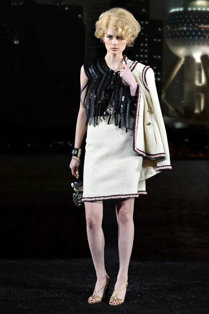 Chanel 2010 Paris-Shanghai China doll clutch in elegant design with intricate detailing and classic Chanel style.