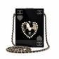 Chanel Pearl Playing Card Casino Minaudière Clutch in glossy black with pearl CC and heart motifs, portrait medallion, gold-tone hardware and chain strap.