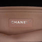 Chanel multicolour quilted patchwork Medium Flap Bag with printed textile panels, gold-tone chain strap, CC turn-lock closure and decorative medallion charm.