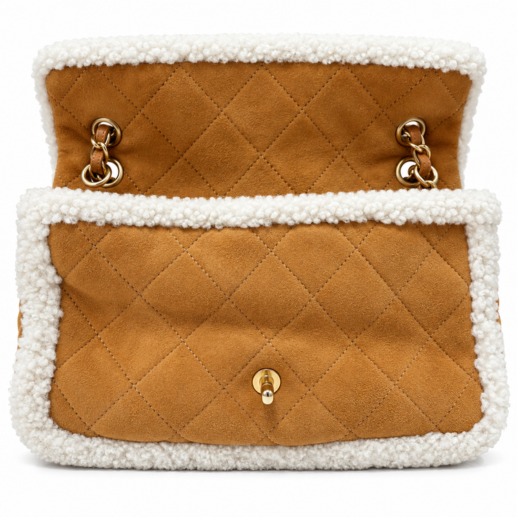 Chanel Jumbo suede shearling quilted Coco Neige flap shoulder bag with gold-tone hardware and quilted design.