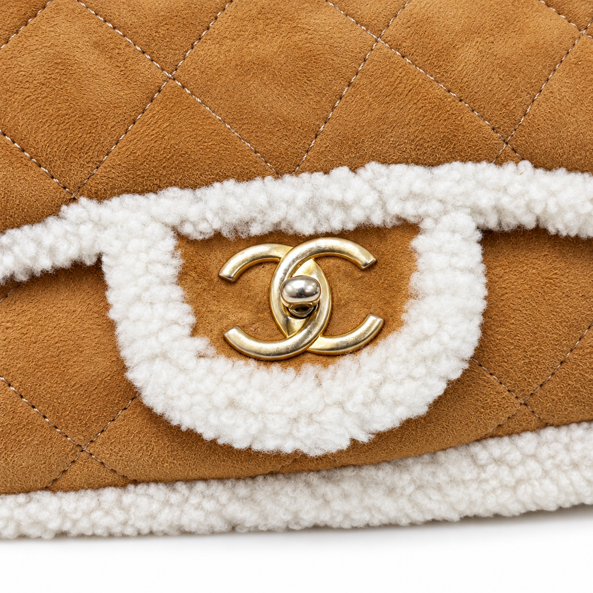 Chanel jumbo suede shearling quilted Coco Neige flap shoulder bag with quilted pattern and silver hardware, stylish and luxurious.