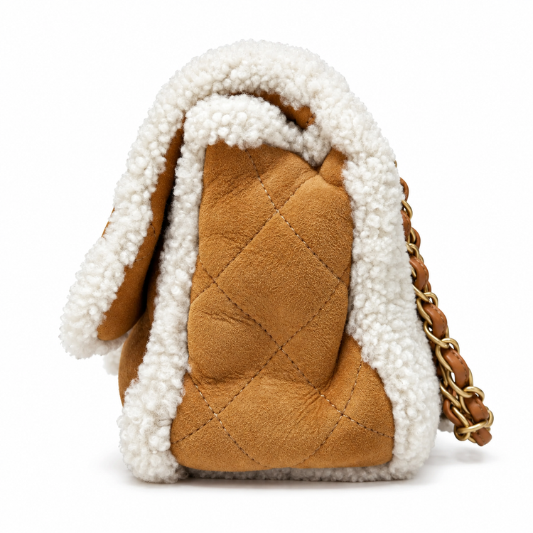 Chanel jumbo suede shearling quilted Coco Neige flap shoulder bag with quilted pattern and silver chain strap.