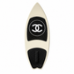 2019 Chanel white and black CC logo wakesurf board with pointed shape, black quilted traction pads, oversized interlocking CC logo, circular Chanel emblem, and collectible luxury board design.