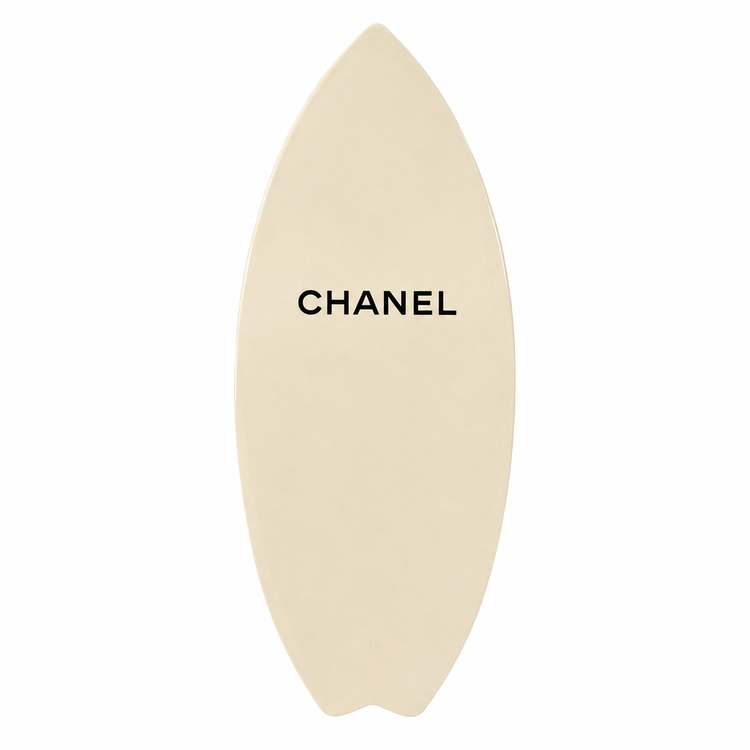 2019 Chanel white and black CC logo wakesurf board with pointed shape, black quilted traction pads, oversized interlocking CC logo, circular Chanel emblem, and collectible luxury board design.