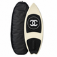 2019 Chanel white and black CC logo wakesurf board with pointed shape, black quilted traction pads, oversized interlocking CC logo, circular Chanel emblem, and collectible luxury board design.