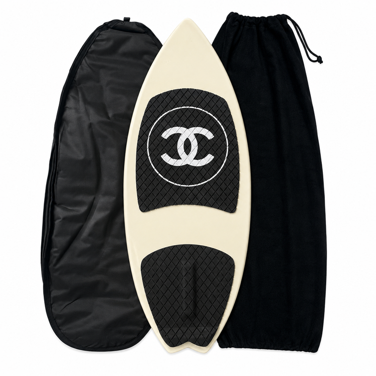 2019 Chanel white and black CC logo wakesurf board with pointed shape, black quilted traction pads, oversized interlocking CC logo, circular Chanel emblem, and collectible luxury board design.