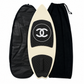 2019 Chanel white and black CC logo wakesurf board with pointed shape, black quilted traction pads, oversized interlocking CC logo, circular Chanel emblem, and collectible luxury board design.