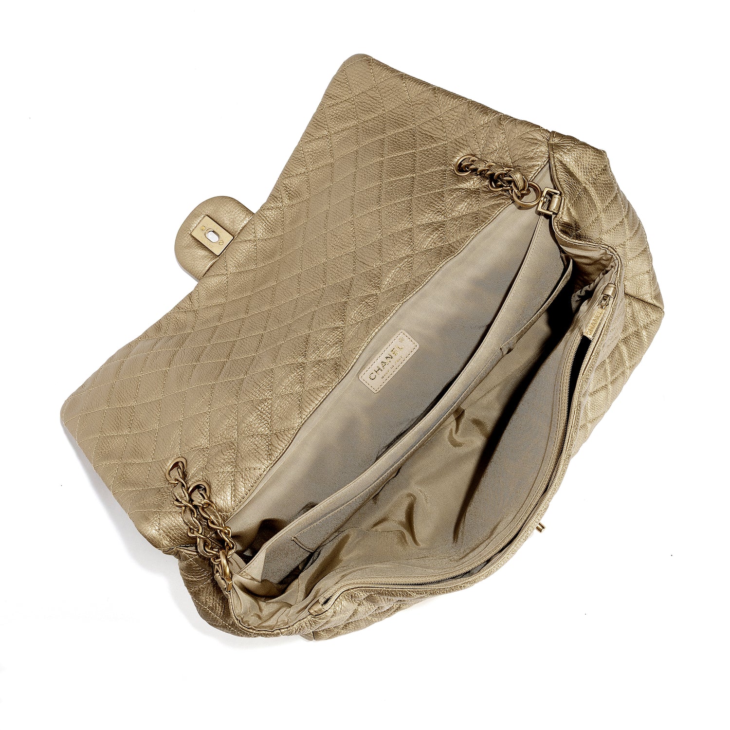 Gold metallic Chanel XXL airline travel flap bag with shoulder strap and interior compartments, stylish and spacious for travel.