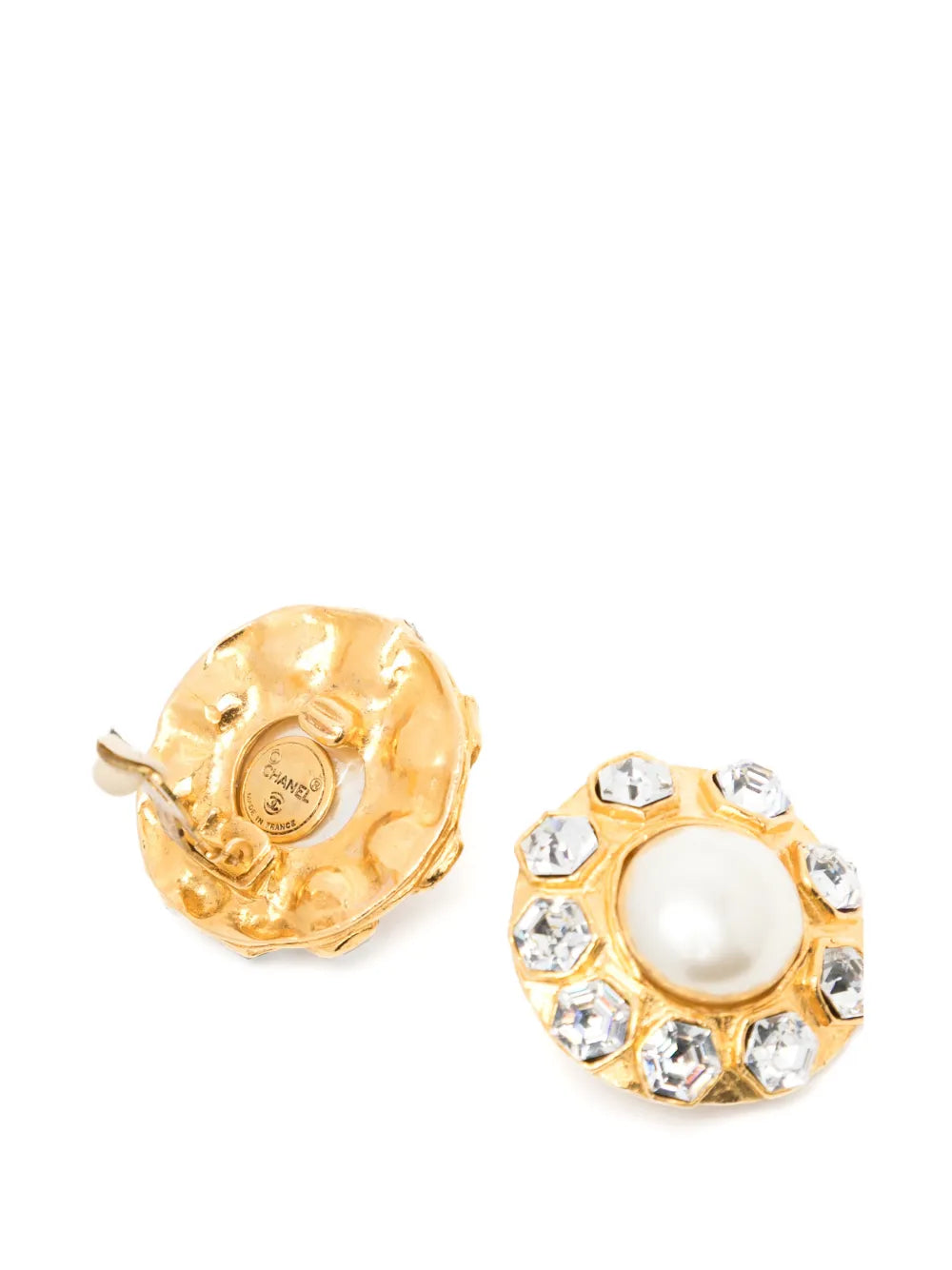 Pair of vintage 1970s Chanel gold-plated clip-on flower earrings featuring a central faux pearl cabochon surrounded by a halo of clear crystals.