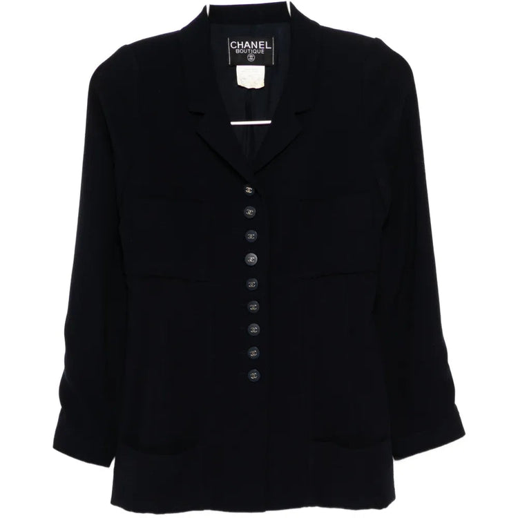 Chanel 1996 navy wool blazer with silver CC buttons, tailored fit, classic collar, and long sleeves.