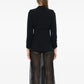 Chanel 1996 navy wool blazer with silver CC buttons, tailored fit and classic style, shown on a hanger.