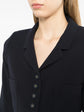 Navy wool Chanel blazer with silver CC buttons, 1996 design, tailored fit and classic style, front view with lapel collar.
