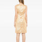 Chanel 1996 sleeveless gold brocade shift dress with intricate woven pattern and elegant fit, perfect for formal occasions.