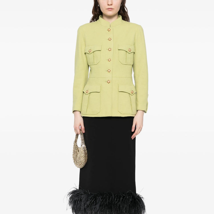 Light green vintage Chanel blazer from 1996, fitted style with classic tailored design and elegant details.