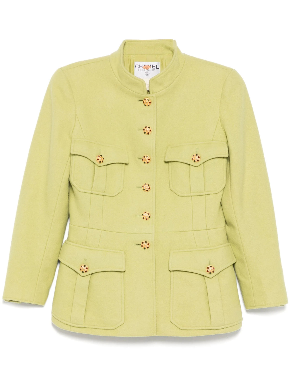 Light green vintage Chanel blazer from 1996, fitted style with classic tailored design, shown on a model.