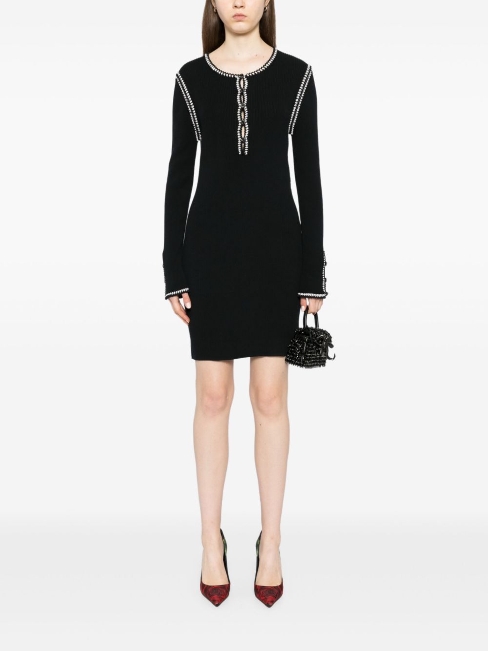 Black Chanel 2002 cotton mini dress with ribbed fabric and stylish design, perfect for casual or semi-formal occasions.