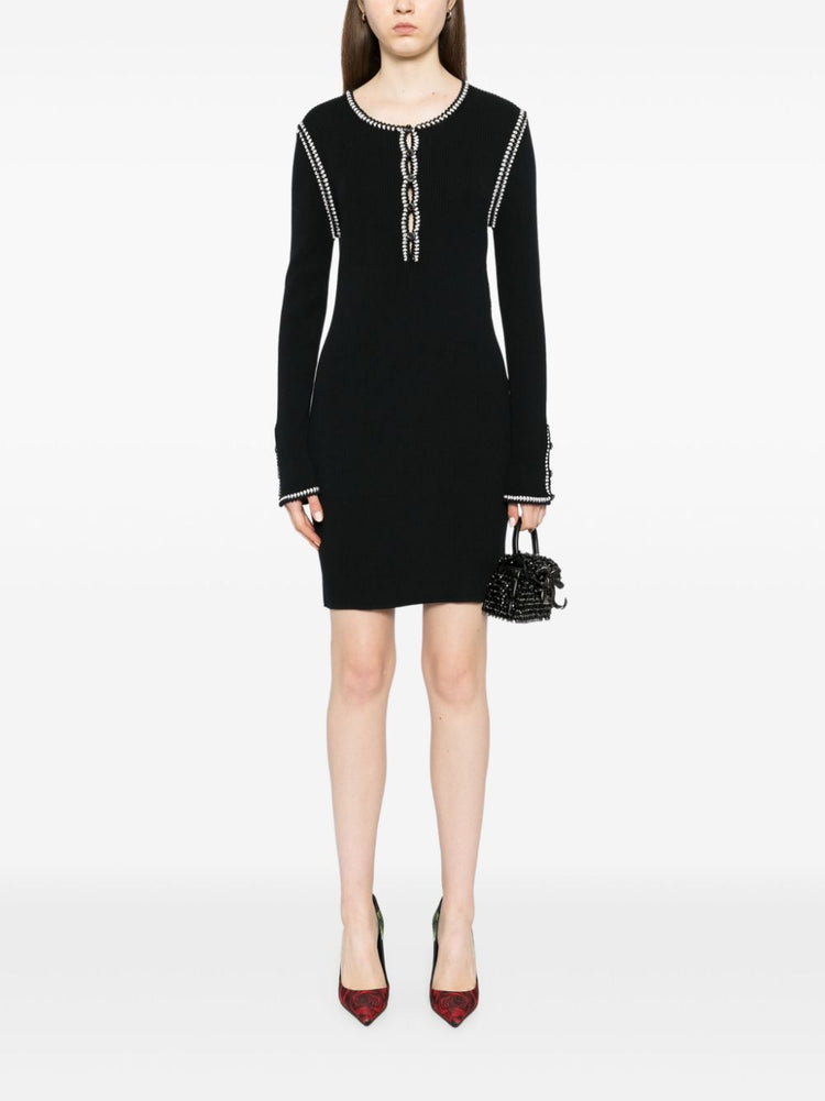 Black Chanel 2002 cotton mini dress with ribbed fabric and stylish design, perfect for casual or semi-formal occasions.