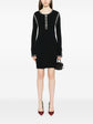 Black Chanel 2002 cotton mini dress with ribbed fabric and stylish design, perfect for casual or semi-formal occasions.
