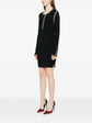 Black Chanel 2002 cotton mini dress with ribbed fabric, stylish and fitted, perfect for casual or semi-formal occasions.
