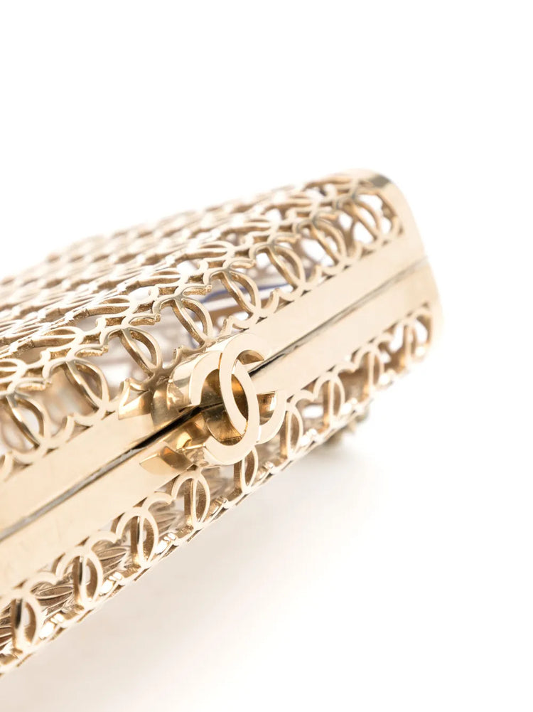 Chanel 2015 CC Moucharabieh minaudière clutch with intricate design, black and gold details, and elegant chain strap.