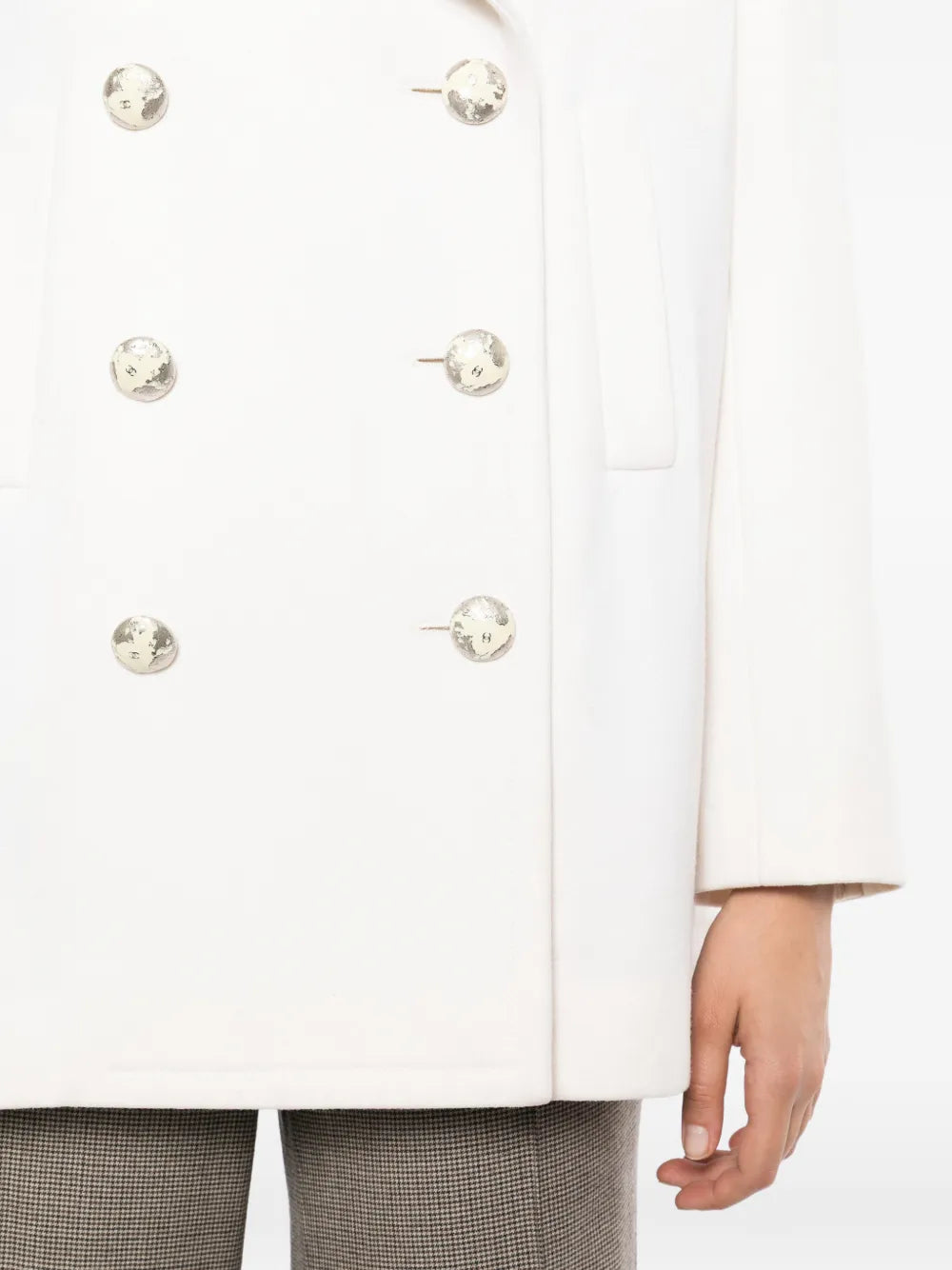Chanel 2017 ecru wool and cashmere peacoat with classic double-breasted design and large buttons, displayed on a hanger.