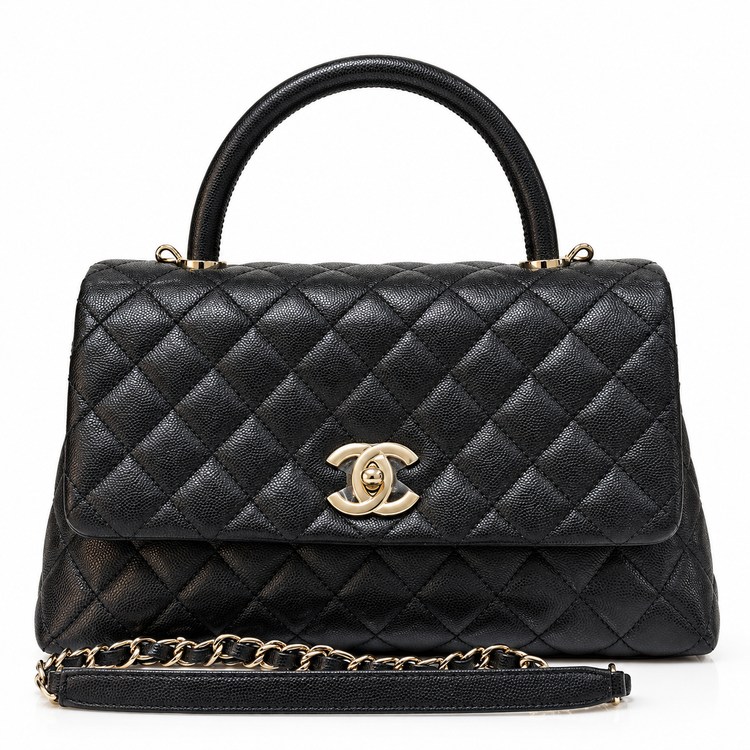 Chanel 2021 Medium Coco Handle Flap Bag in black quilted caviar leather with gold-tone CC hardware, top handle and detachable chain strap.