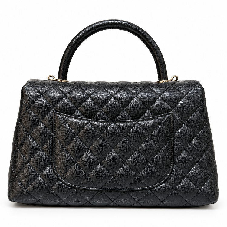Chanel 2021 Medium Coco Handle Flap Bag in black quilted caviar leather with gold-tone CC hardware, top handle and detachable chain strap.