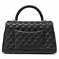Chanel 2021 Medium Coco Handle Flap Bag in black quilted caviar leather with gold-tone CC hardware, top handle and detachable chain strap.