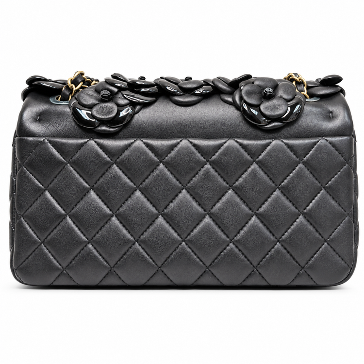 Chanel 2014–2015 black lambskin and patent leather 3D Camellia Flower Medium Flap Bag with gold-tone CC hardware and chain strap.