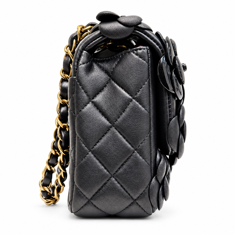 Chanel 2014–2015 black lambskin and patent leather 3D Camellia Flower Medium Flap Bag with gold-tone CC hardware and chain strap.