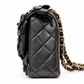 Chanel 2014–2015 black lambskin and patent leather 3D Camellia Flower Medium Flap Bag with gold-tone CC hardware and chain strap.