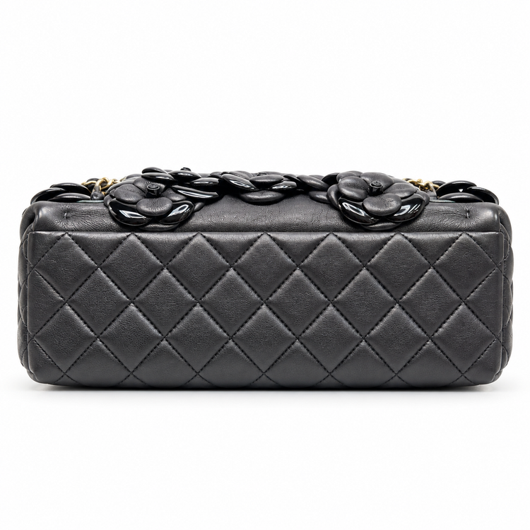 Chanel 2014–2015 black lambskin and patent leather 3D Camellia Flower Medium Flap Bag with gold-tone CC hardware and chain strap.
