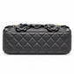 Chanel 2014–2015 black lambskin and patent leather 3D Camellia Flower Medium Flap Bag with gold-tone CC hardware and chain strap.