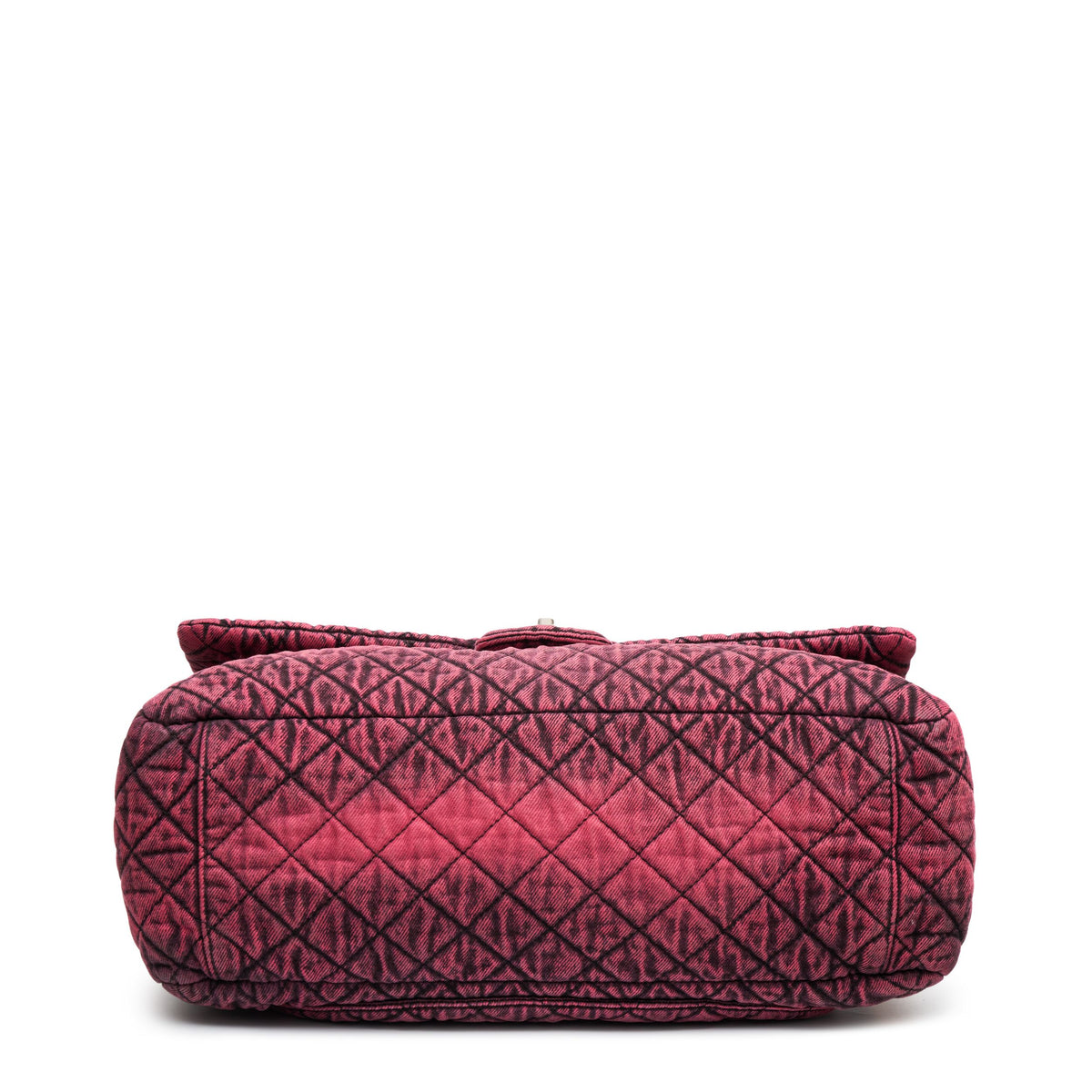 Chanel Airline pink denim XXL flap bag with black graphic quilted pattern, CC turn-lock closure, silver-tone hardware and chain-and-denim shoulder straps.