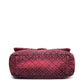 Chanel Airline pink denim XXL flap bag with black graphic quilted pattern, CC turn-lock closure, silver-tone hardware and chain-and-denim shoulder straps.