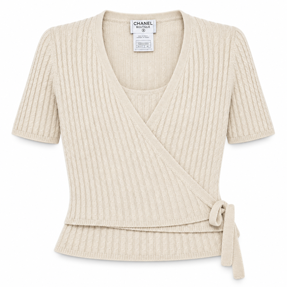 Front view of Chanel beige cashmere top from the Chanel cashmere set, showcasing soft fabric and elegant design.