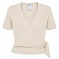 Front view of Chanel beige cashmere top from the Chanel cashmere set, showcasing soft fabric and elegant design.