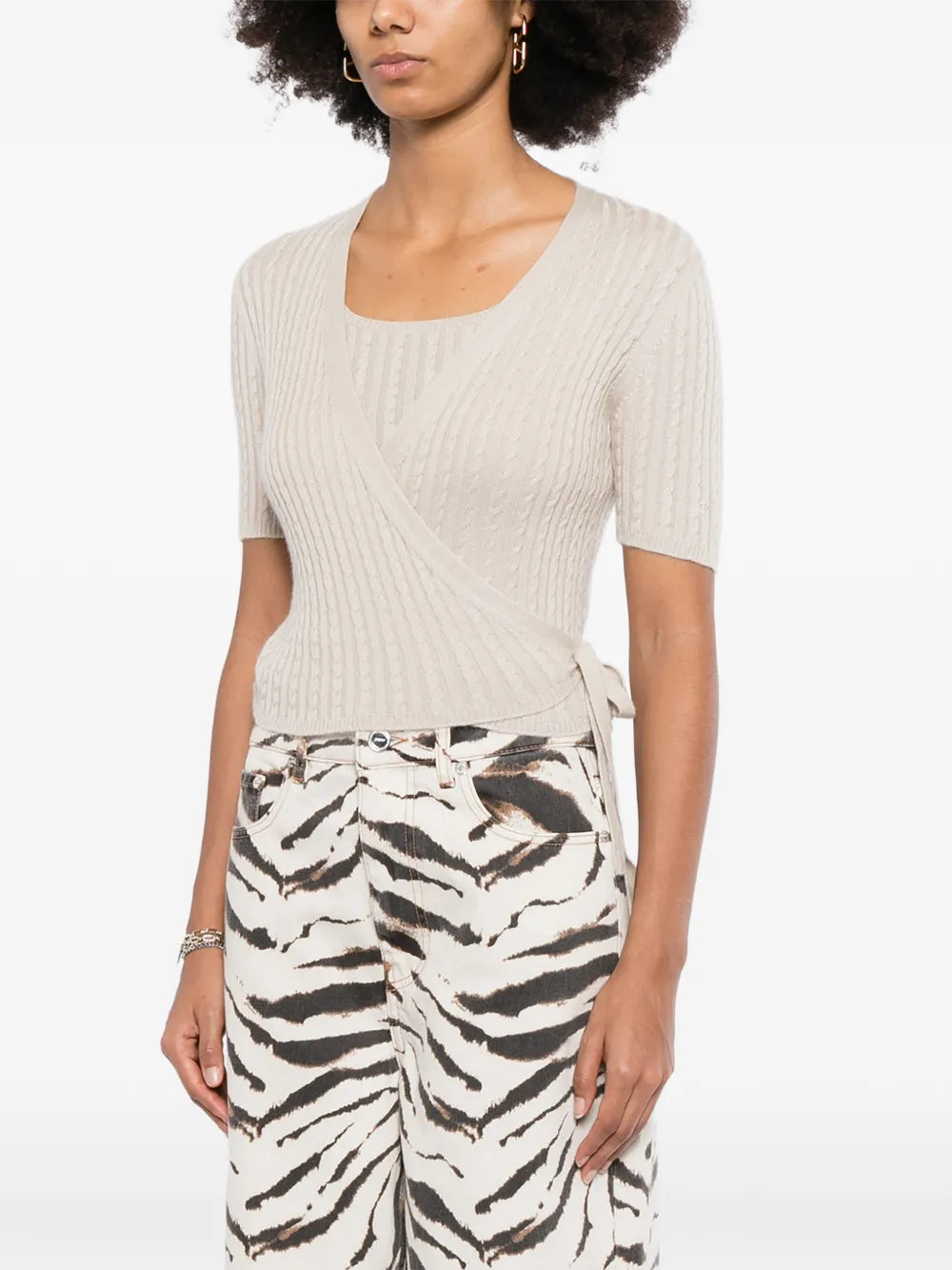 Pre-owned Chanel beige cashmere top set, soft and luxurious knit with a classic design, displayed on a neutral background.