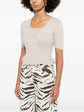 Pre-owned Chanel beige cashmere top set, soft and luxurious knit with a classic design, displayed on a neutral background.