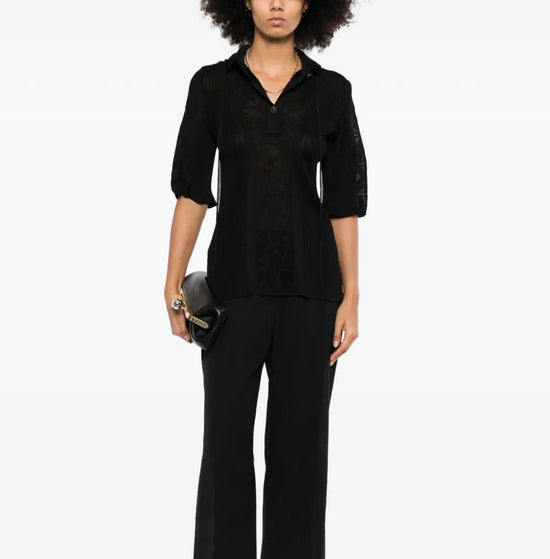 Black Chanel lace-panel polo top with hood, featuring elegant lace detailing and a classic, stylish design.