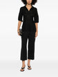 Black Chanel lace-panel polo top with hood, featuring elegant lace detailing and a classic, stylish design.