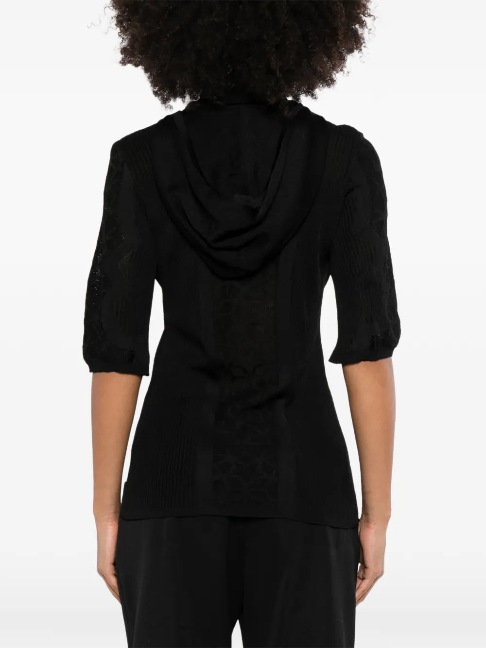Black Chanel lace-panel polo top with hood, featuring intricate lace details and a stylish, casual design.