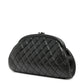 Chanel black clutch, side view of quilted leather