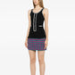 Black ribbed knit contrast tank top by Chanel, showcasing a close-up of the fitted, sleeveless design with textured fabric.