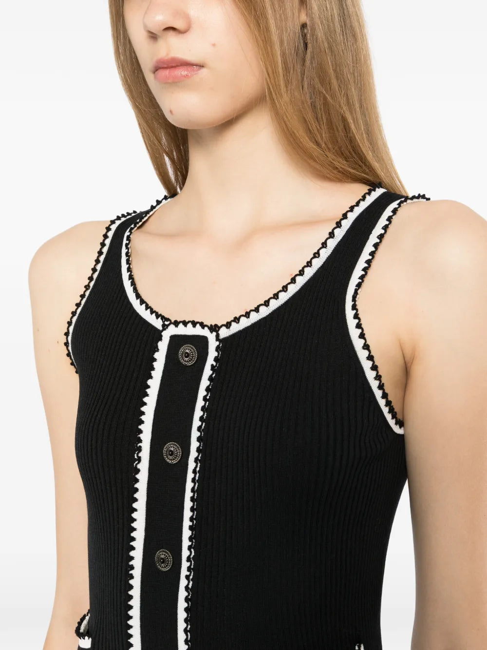 Black ribbed knit contrast tank top from Chanel, showcasing a fitted sleeveless design with ribbed texture and stylish details.