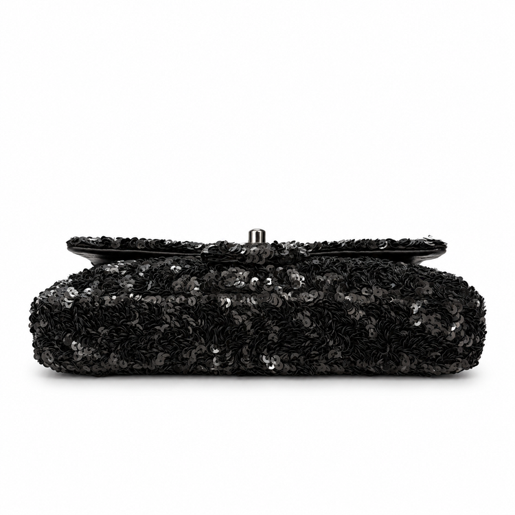Black Chanel sequin east-west flap shoulder bag with gold chain strap and front flap design.